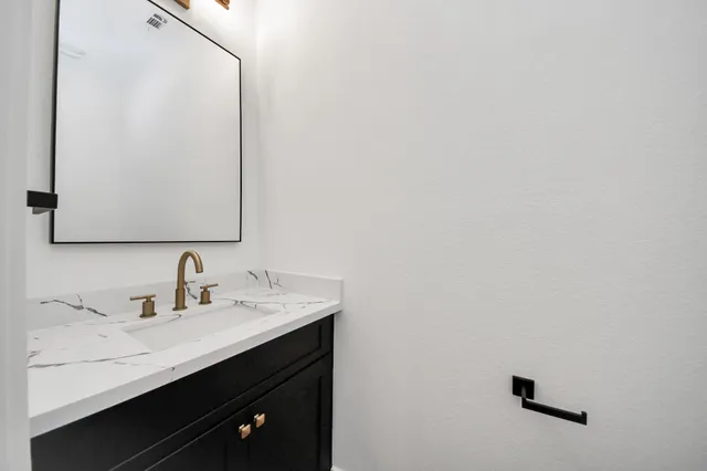 a bathroom with a sink and a toilet