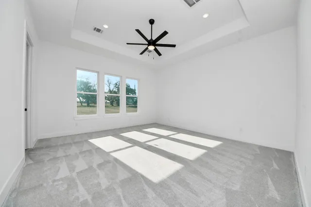 a bathroom with a double vanity sink mirror and bathtub