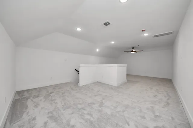 a bathroom with a double vanity sink toilet mirror and bathtub