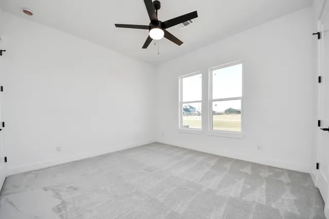 a view of a house with backyard and glass door