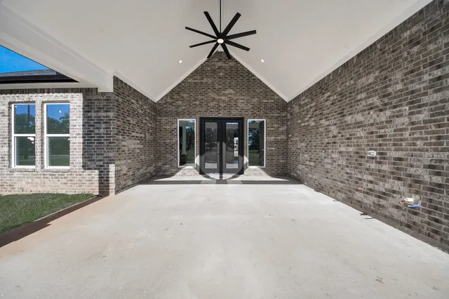 a view of a park that has large trees