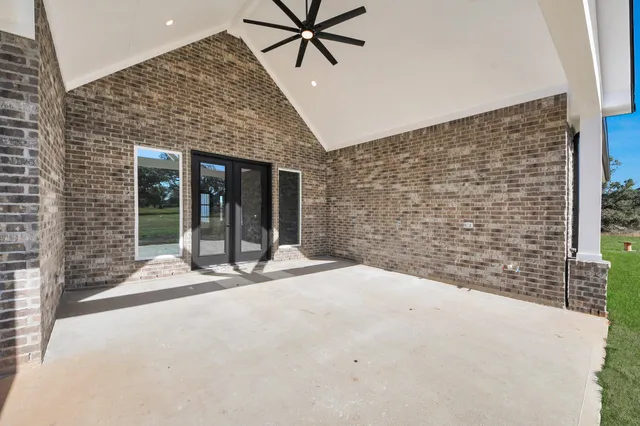 a view of a swimming pool with a yard