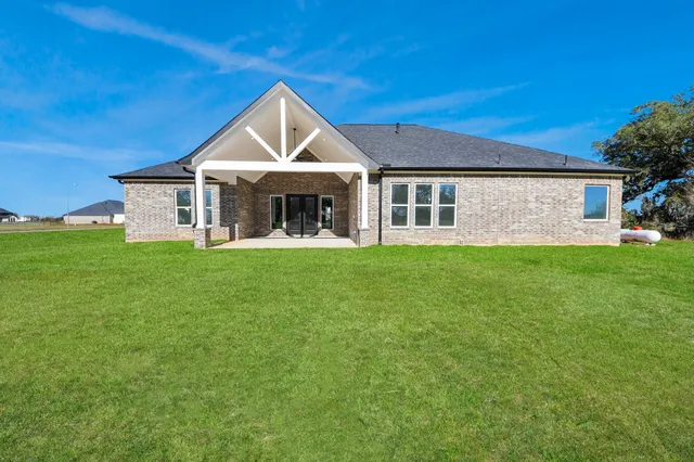 an aerial view of a house with a swimming pool