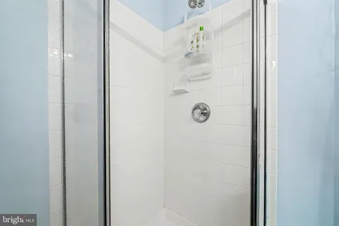 a bed room with a bed and a window