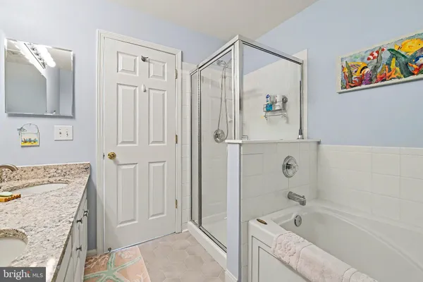 an aerial view of residential building with outdoor space and ocean view