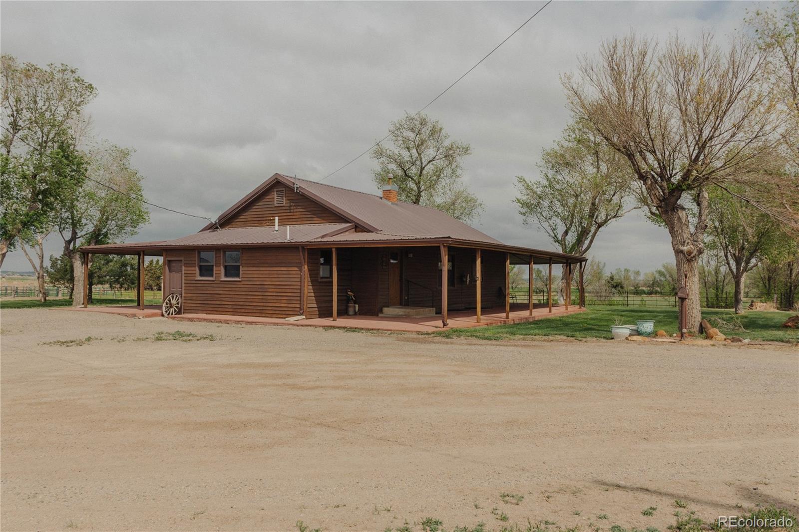 0 County Road 24 La Junta, CO 81050 - Photo 2 of 34 a front view of a house with a garden
