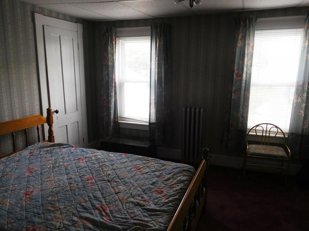19 Juniper Street Lowell, MA 01852 - Photo 20 of 24 a bedroom with a bed and a window