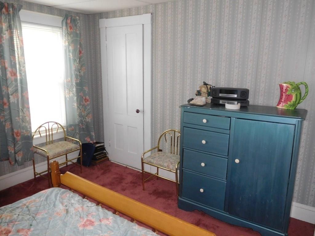 19 Juniper Street Lowell, MA 01852 - Photo 21 of 24 a bedroom with a bed and furniture