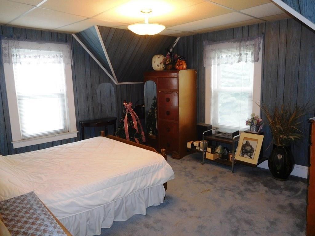 19 Juniper Street Lowell, MA 01852 - Photo 22 of 24 a bedroom with bed and a large window