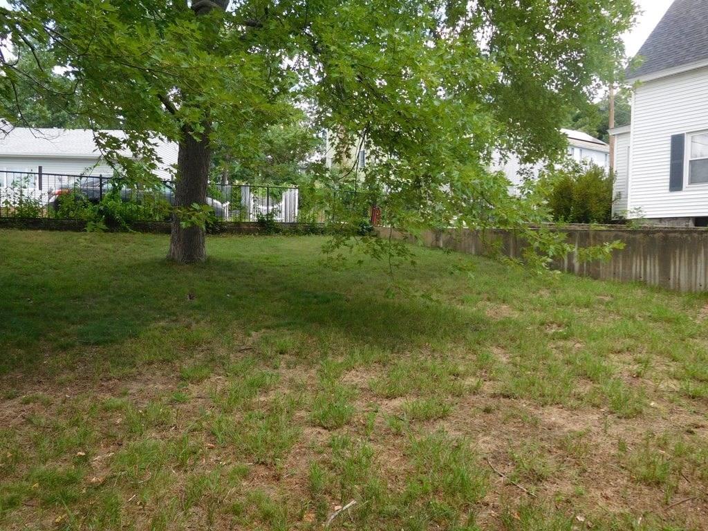 19 Juniper Street Lowell, MA 01852 - Photo 8 of 24 a view of backyard with green space