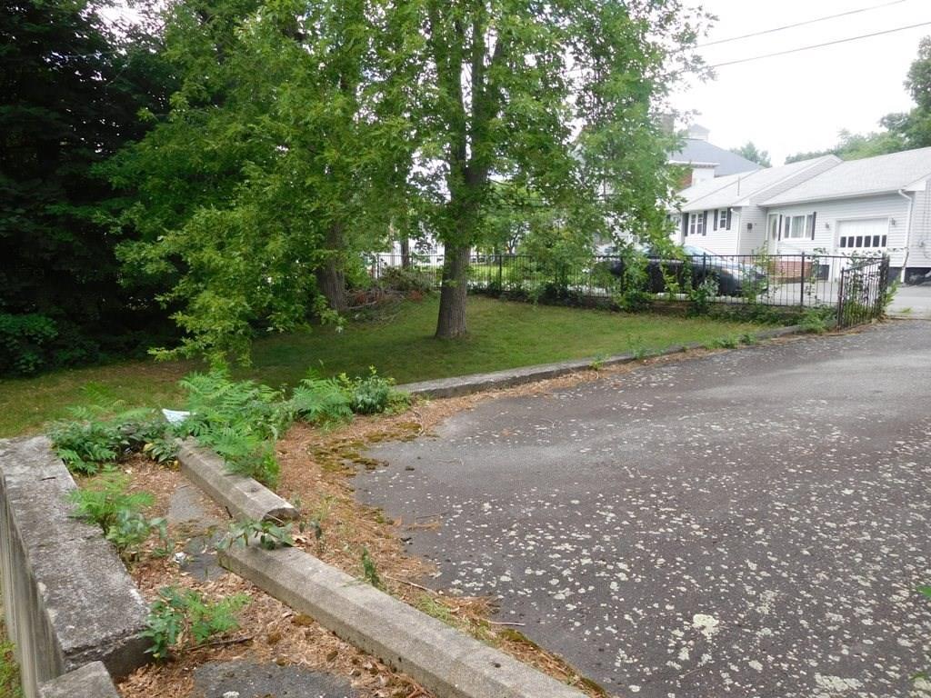 19 Juniper Street Lowell, MA 01852 - Photo 10 of 24 a view of a house with a yard