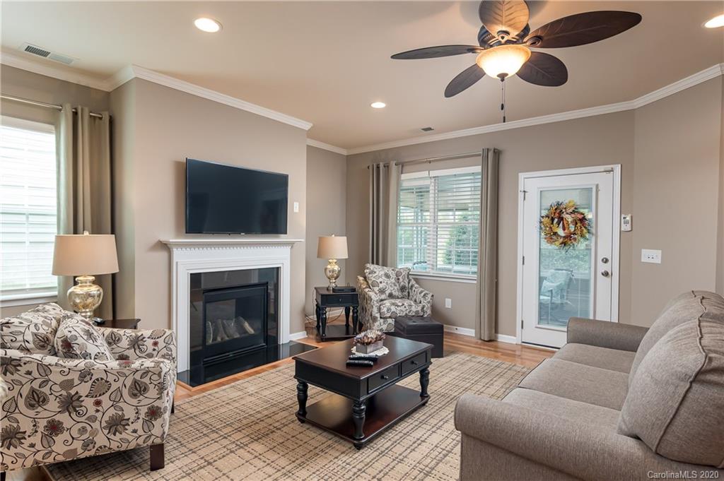 4344 Perth Road, Unit 240 Indian Land, SC 29707 - Photo 14 of 30 a living room with furniture and a fireplace