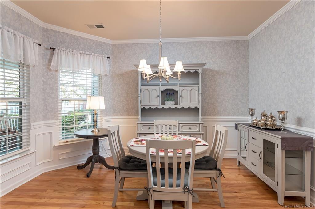 4344 Perth Road, Unit 240 Indian Land, SC 29707 - Photo 9 of 30 a view of a dining room with furniture window and wooden floor