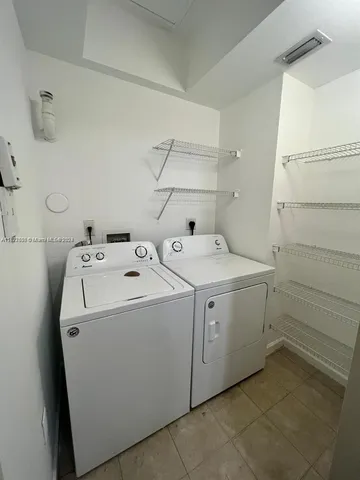 a kitchen that has a sink and a stove