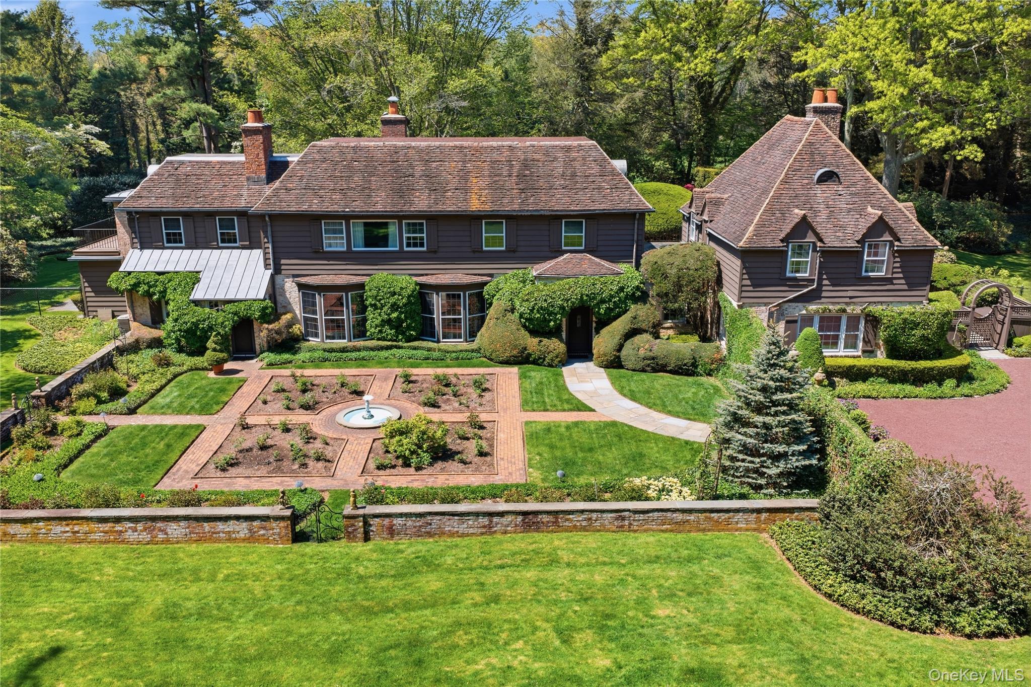 285 Piping Rock Road Locust Valley, NY 11560 - Photo 1 of 28 285 Piping Rock Road Exterior including garden
