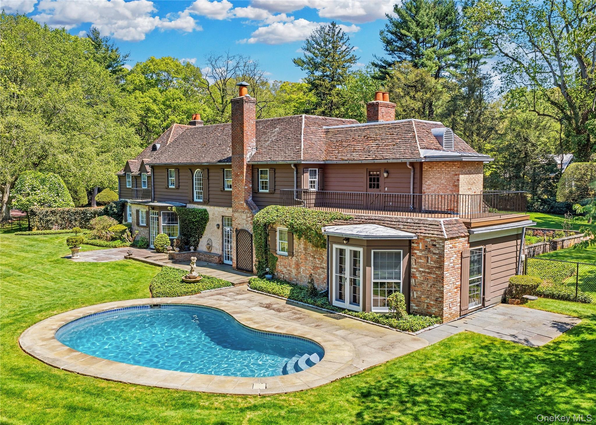 285 Piping Rock Road Locust Valley, NY 11560 - Photo 25 of 28 Beautiful Oval Pool in Back Yard