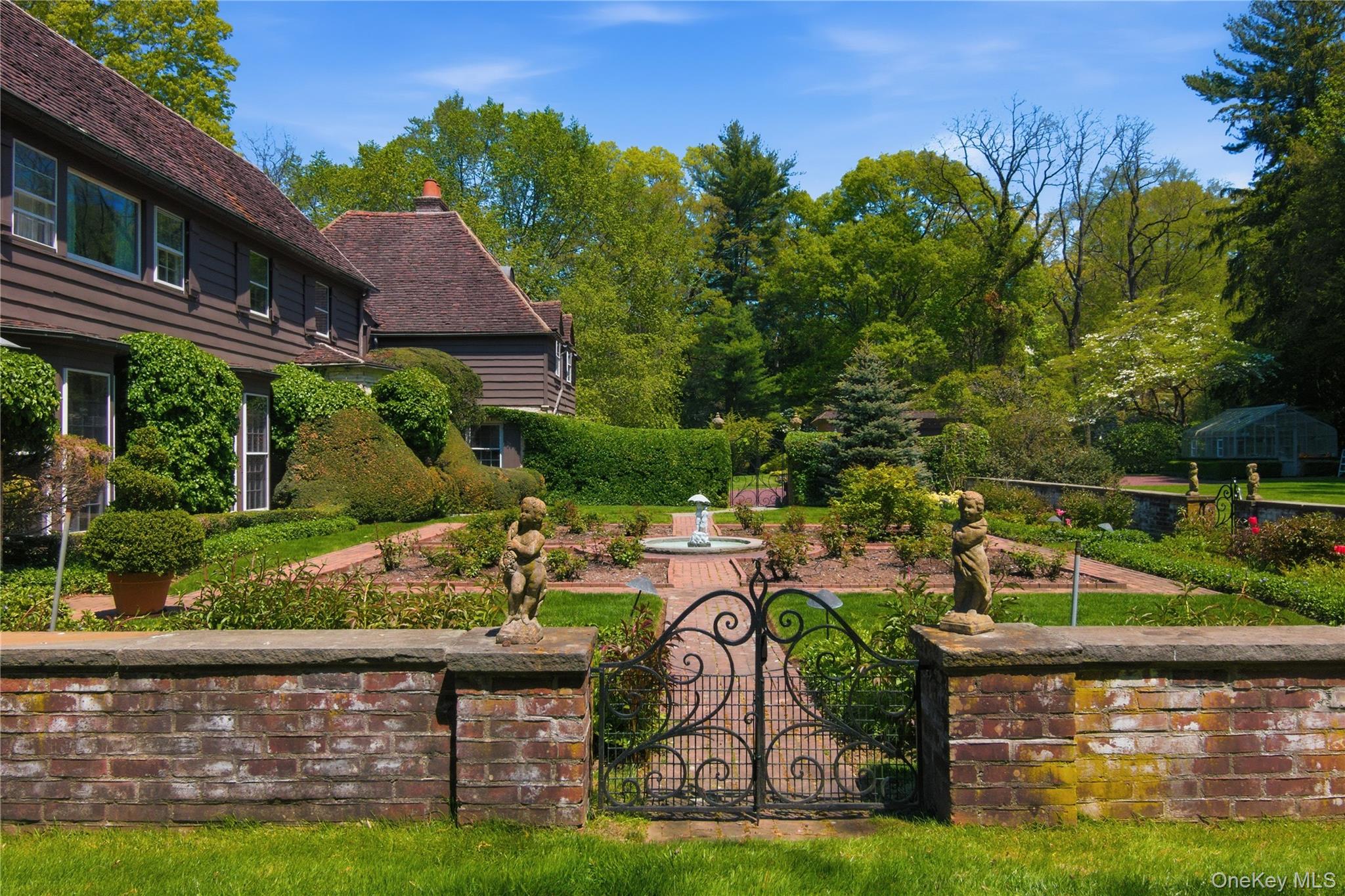 285 Piping Rock Road Locust Valley, NY 11560 - Photo 27 of 28 Side Gate into Walled Rose Garden