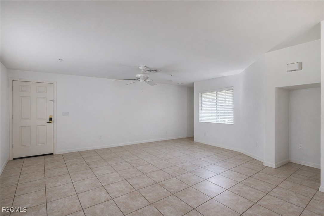 9460 Ivy Brook Run, Unit 710 Fort Myers, FL 33913 - Photo 11 of 23 an empty room with a empty space and windows