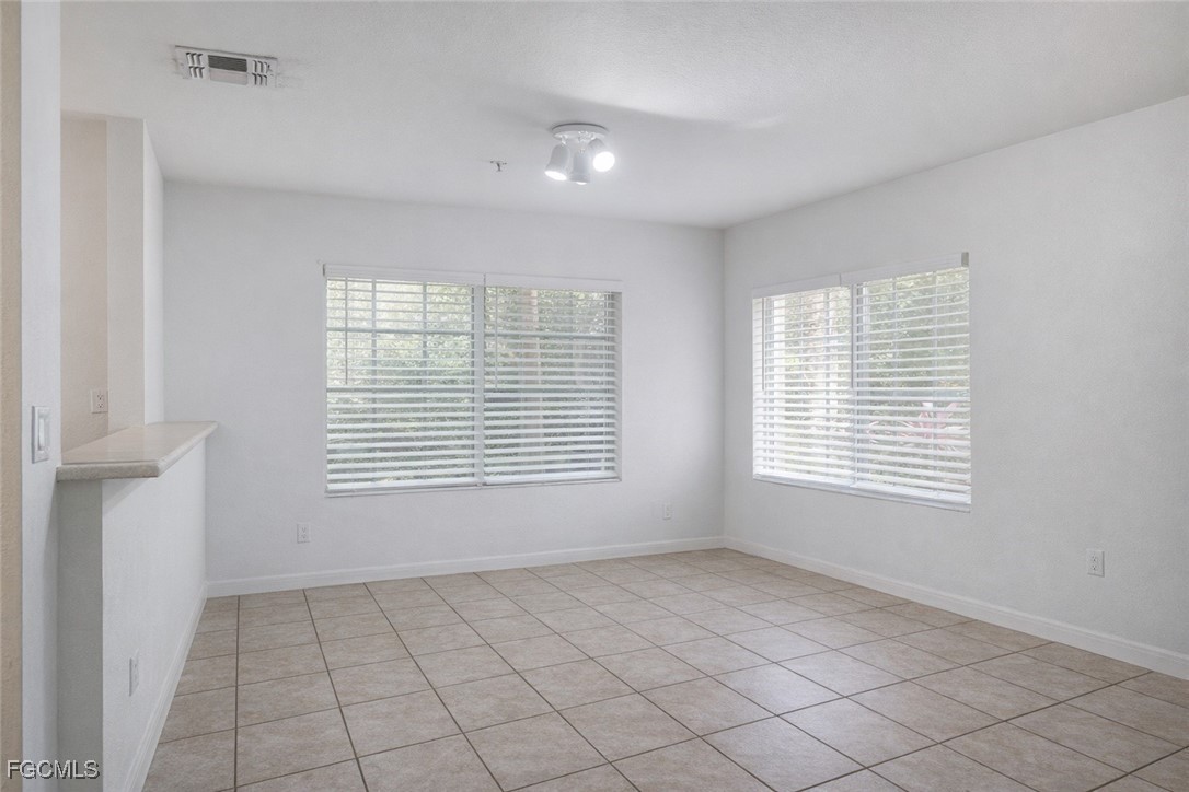 9460 Ivy Brook Run, Unit 710 Fort Myers, FL 33913 - Photo 12 of 23 a view of an empty room with a window
