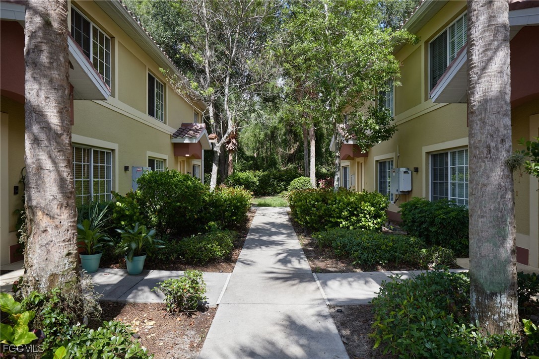 9460 Ivy Brook Run, Unit 710 Fort Myers, FL 33913 - Photo 14 of 23 a view of a pathway both side of house