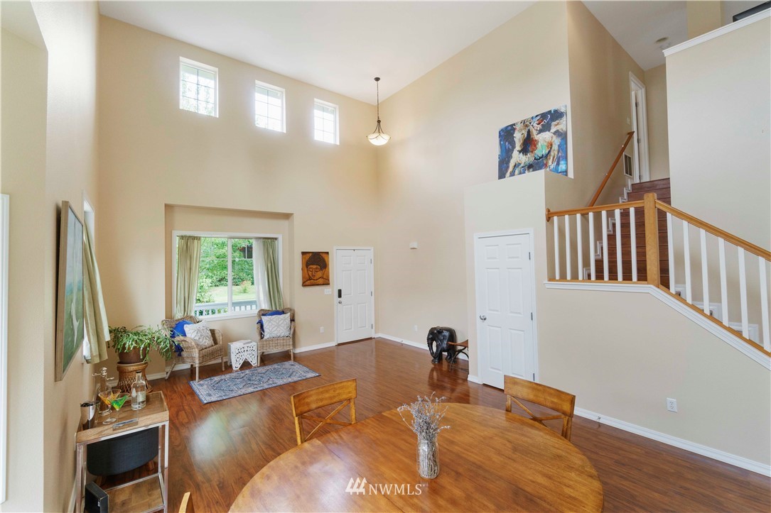 677 Shadow Avenue Northeast Renton, WA 98059 - Photo 5 of 40 a living room with furniture and a large window