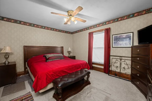 a bedroom with furniture and a window