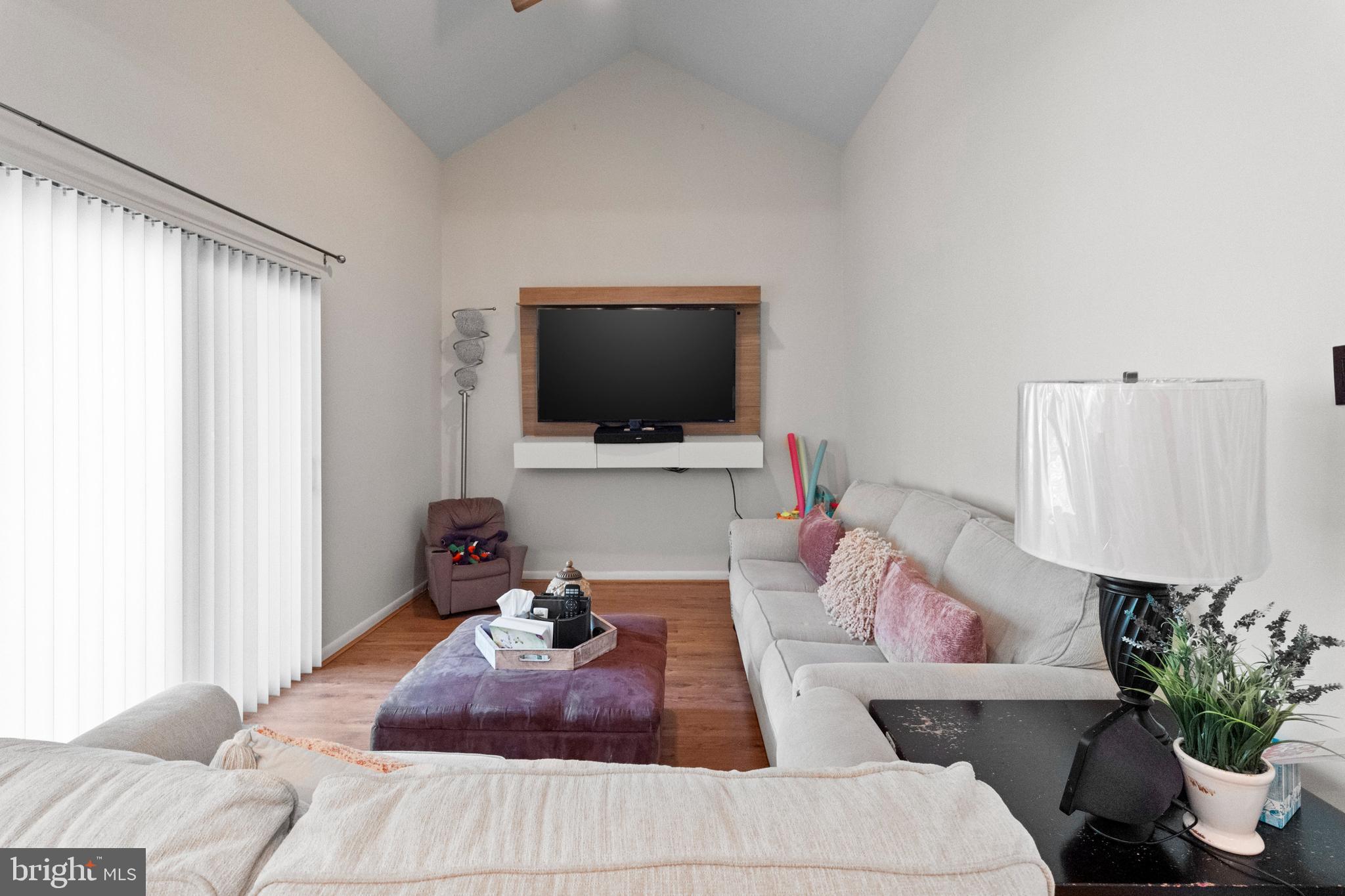 8101 Greenspring Way, Unit 8101E Owings Mills, MD 21117 - Photo 15 of 35 Family Room with Balcony Access