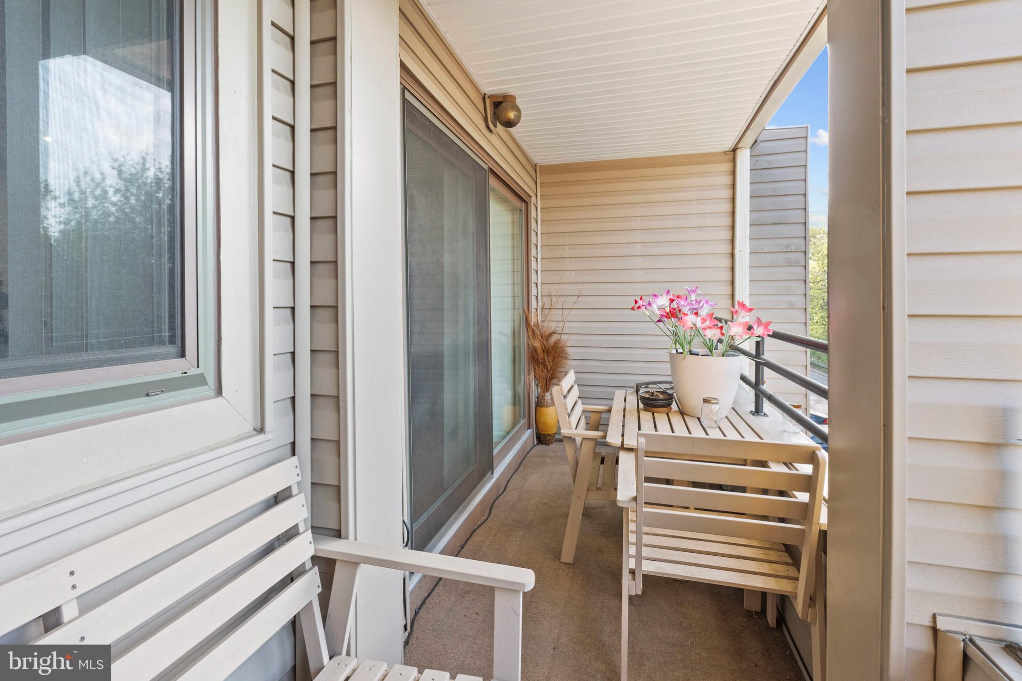 8101 Greenspring Way, Unit 8101E Owings Mills, MD 21117 - Photo 32 of 35 Living Room Balcony