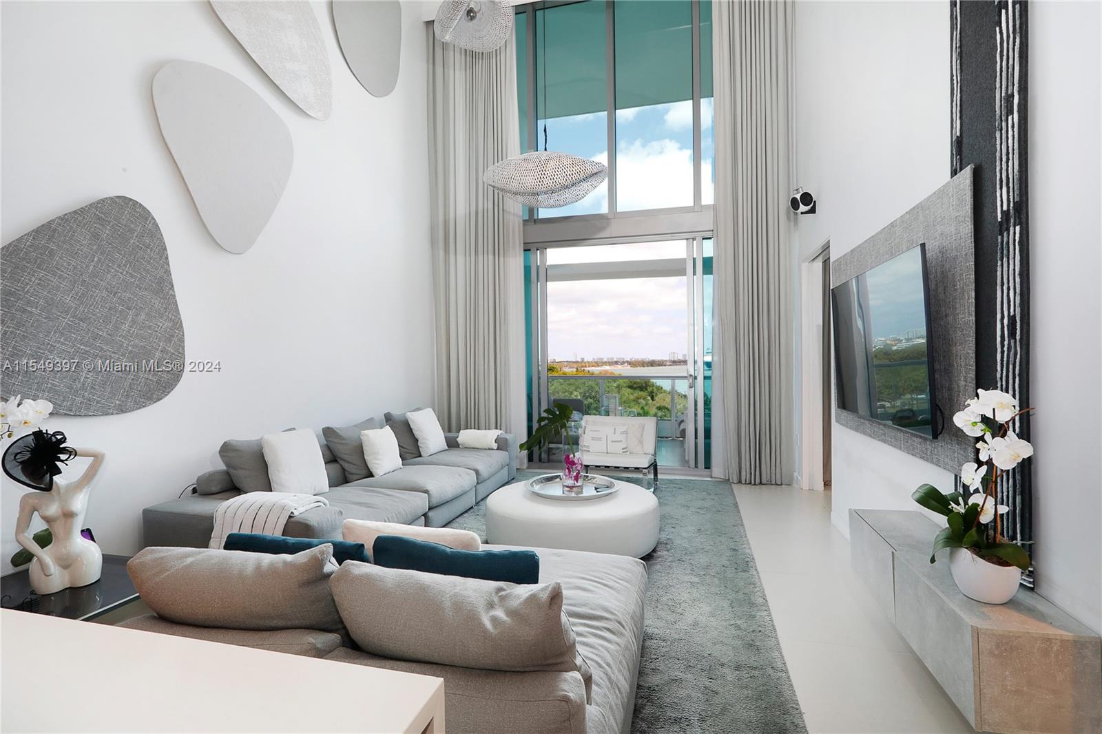 900 Biscayne Boulevard, Unit 705 Miami, FL 33132 - Photo 30 of 30 a living room with furniture and a large window