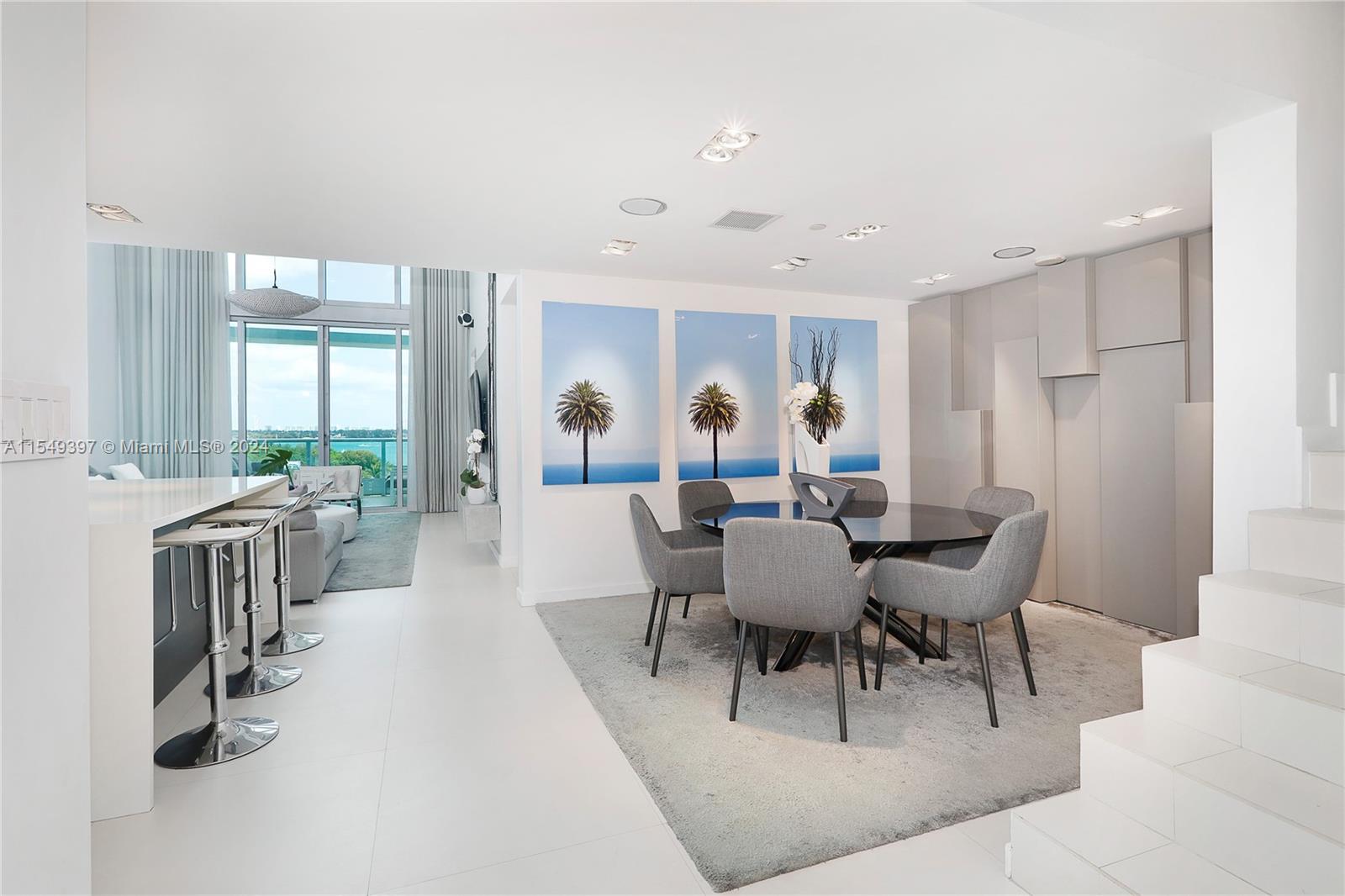 900 Biscayne Boulevard, Unit 705 Miami, FL 33132 - Photo 4 of 30 a view of a dining room with furniture