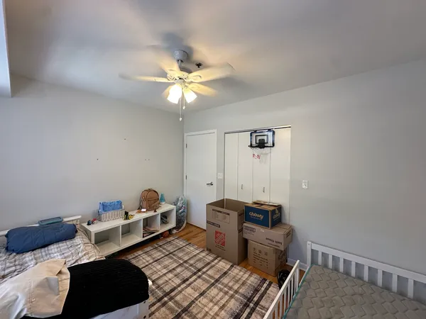 a bedroom with furniture and a chandelier