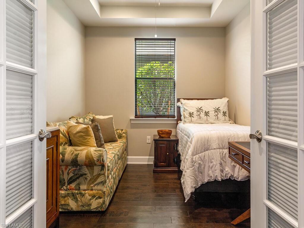 7263 Clamshell Lane Naples, FL 34114 - Photo 9 of 11 a bedroom with a bed and window