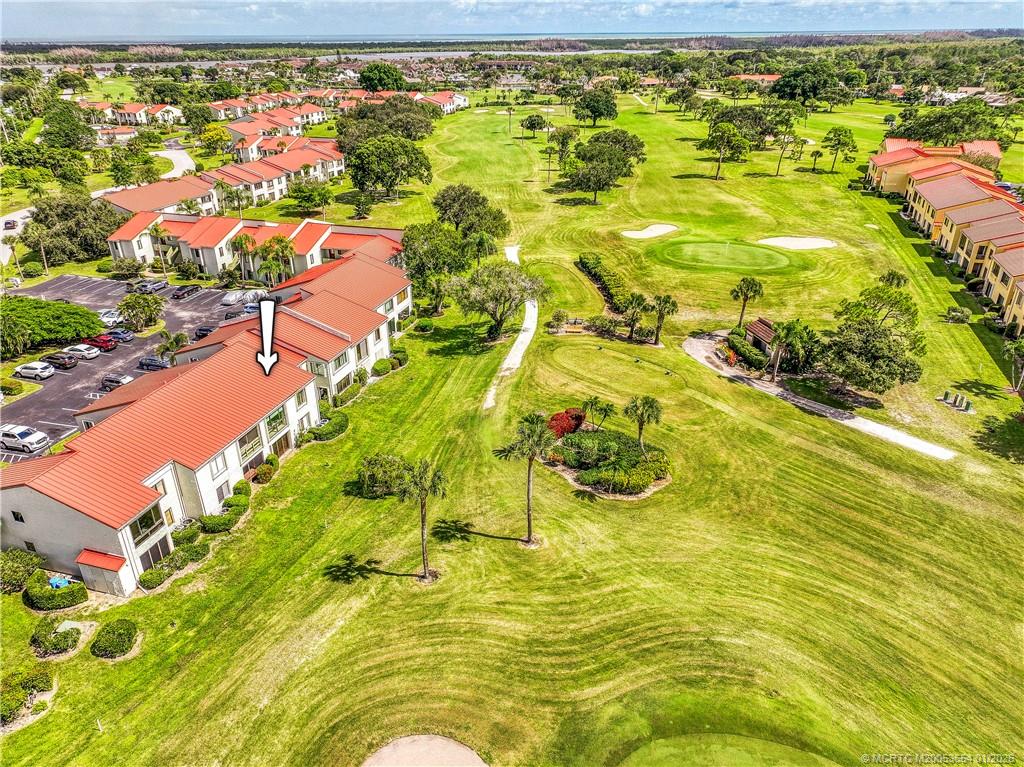 5403 Southeast Miles Grant Road, Unit 209 Stuart, FL 34997 - Photo 1 of 18 a view of an swimming pool and outdoor space