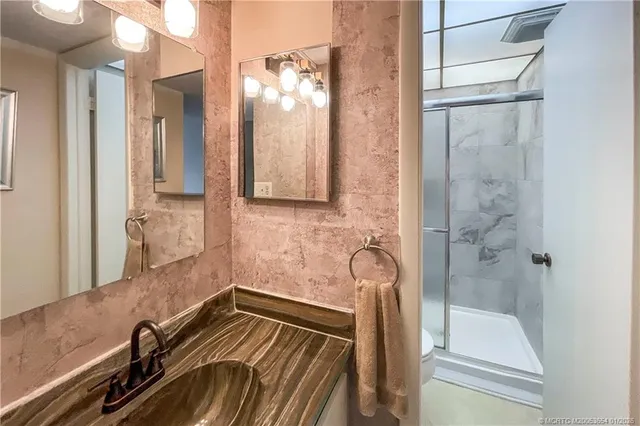 a bathroom with a bathtub and shower