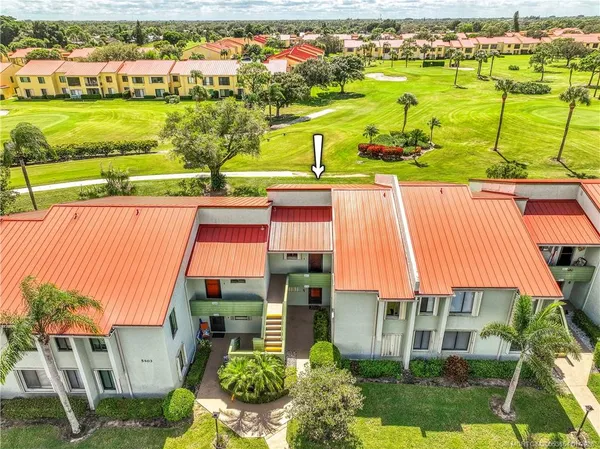 a aerial view of a house with a yard