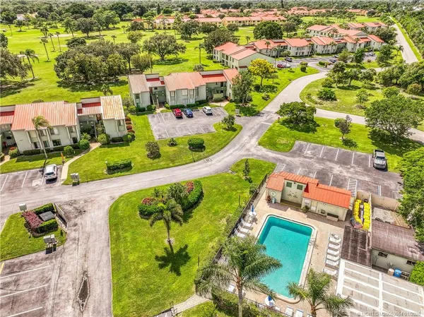 an aerial view of residential houses with outdoor space