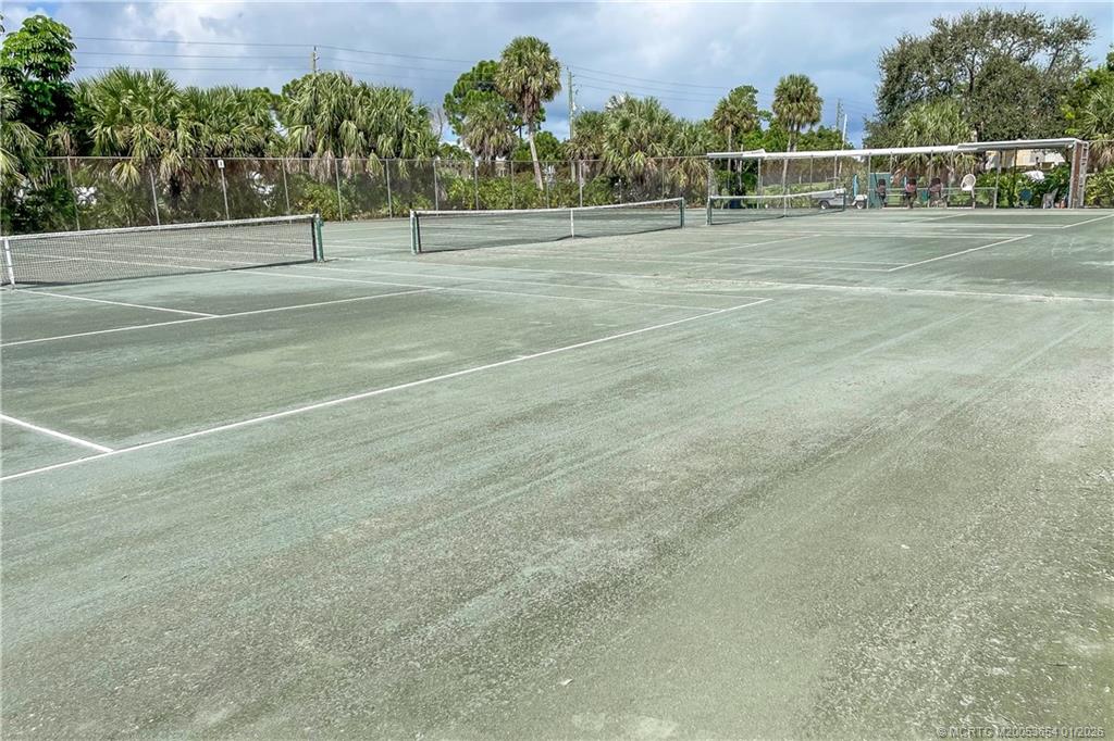 5403 Southeast Miles Grant Road, Unit 209 Stuart, FL 34997 - Photo 17 of 18 a view of a tennis court