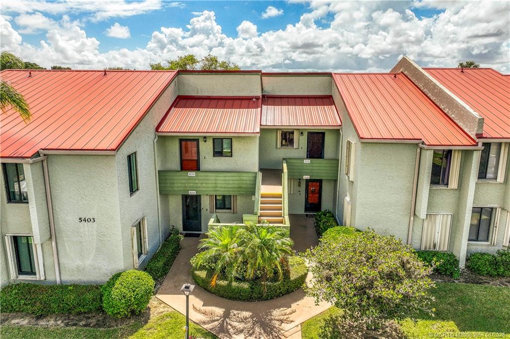 5403 Southeast Miles Grant Road, Unit 209 Stuart, FL 34997 - Photo 3 of 18 a front view of a house