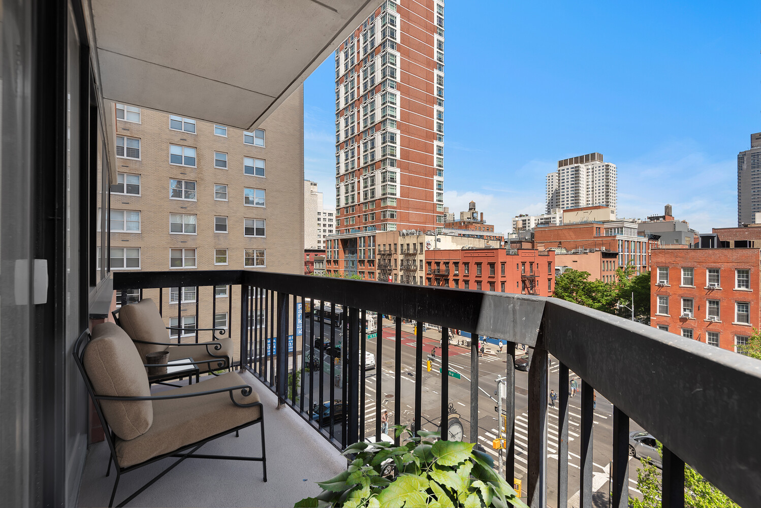 330 East 75th Street, Unit 4B Manhattan, NY 10021 - Photo 3 of 12 a view of a balcony with wooden chairs