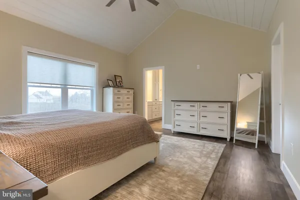a bedroom with a bed and dresser