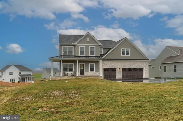 a front view of a house with a ocean view
