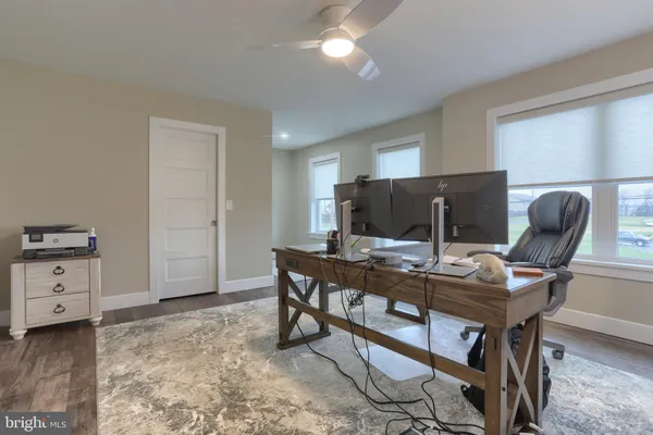 a view of a workspace with furniture