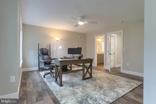 a view of a workspace with furniture