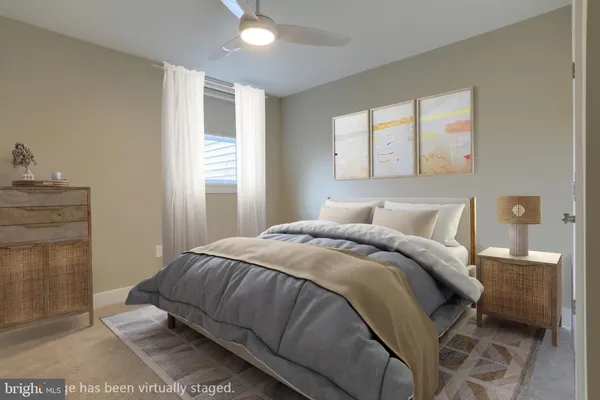 a bedroom with a bed and window