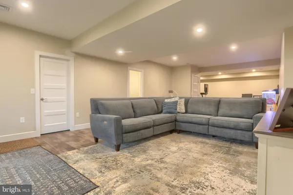 a living room with furniture and a rug