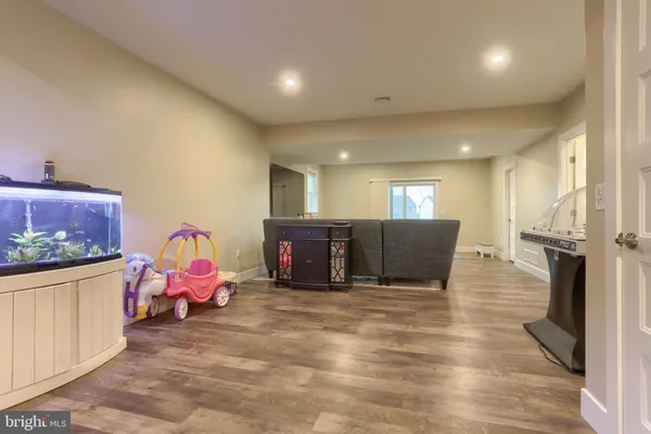 a view of kitchen with furniture and refrigerator