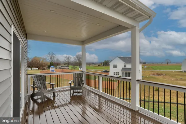 a view of a balcony with furniture