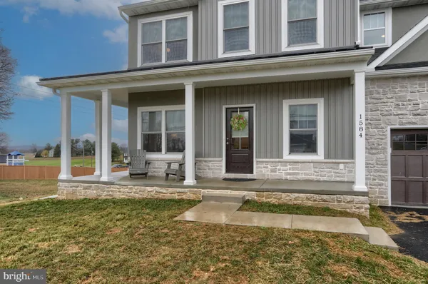 a swimming pool with the outdoor seating