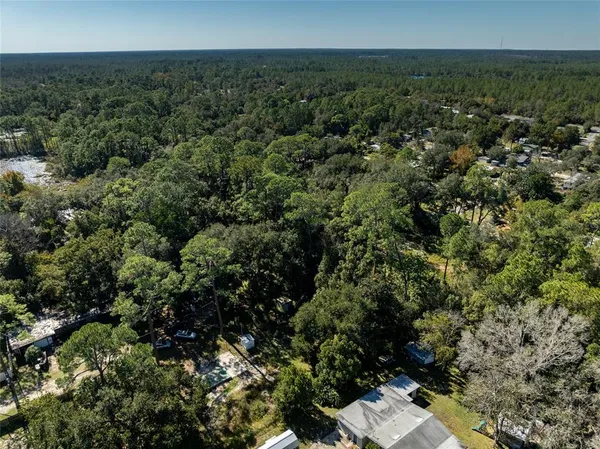 an aerial view of residential house with outdoor space