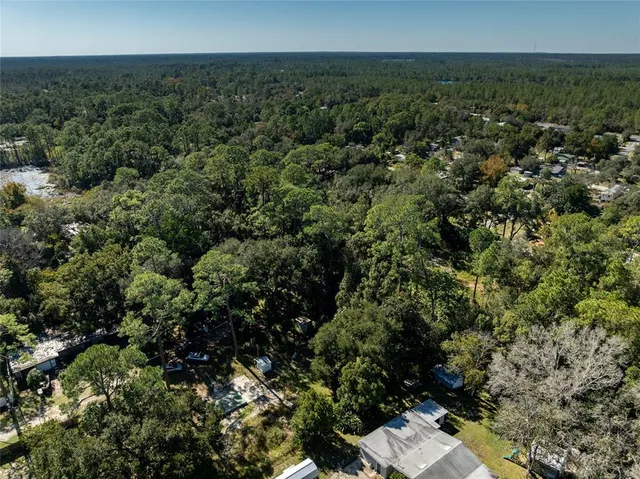 an aerial view of residential house with outdoor space
